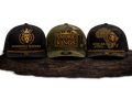 Mandingo Maduro Cigars LLC black trucker hat with gold crowned lion logo